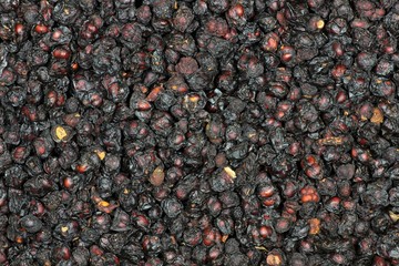 getrocknete Schisandrabeeren als Hintergrundbild