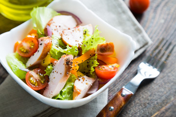 Salad of vegetables and smoked chicken