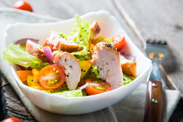 Salad of vegetables and smoked chicken