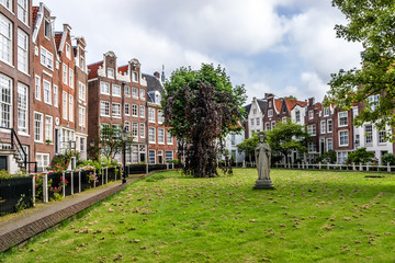 World famous Begijnhof - one of oldest inner courts in Amsterdam © dbrnjhrj