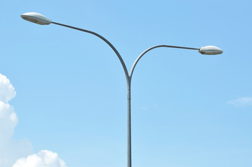 Y shape street lamp pole with blue sky