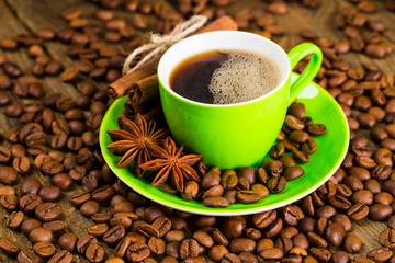 Coffee and coffee bean on wood background