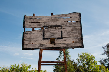 Basketball hoop is broken and wood board damaged ,Shiny wooden basketball