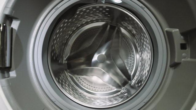 Turning of washing machine drum. Washing machine drum inside.