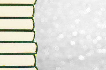 Stack of books with bokeh background for copy space area