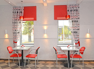 Interior of cafe with red chairs - obrazy, fototapety, plakaty