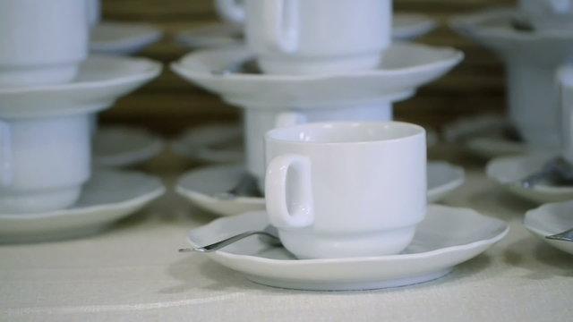 Many White Tea Cups in Table