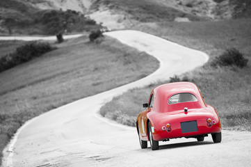 Red vintage car on black and white background