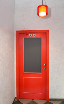 Red door in a public toilet