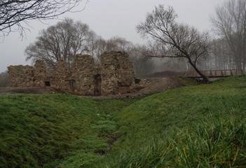 ruins of stone building in fog