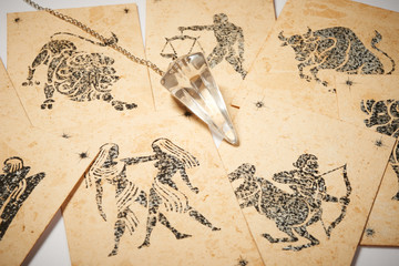 Crystal pendulum with zodiac card