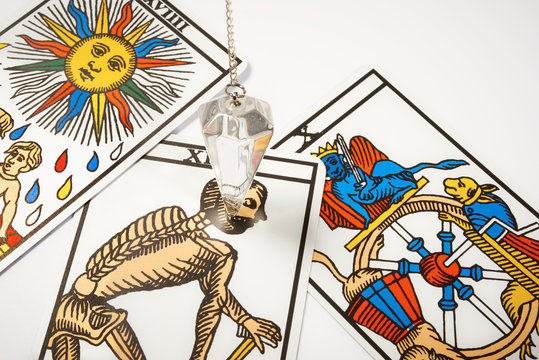 White crystal Pendulum with tarot cards