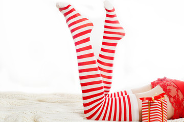 Sexy Santa woman legs with gift 