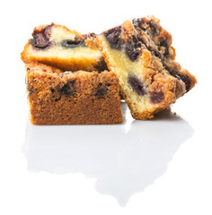 Portions of blueberry sponge cake over white background
