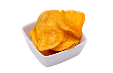 Chips paprika on square bowl on a white background