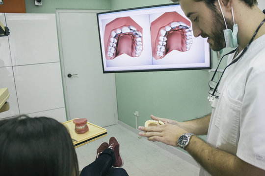 Dentist talking with a patient