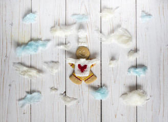 Gingerbread cookie men among the clouds, on the white background
