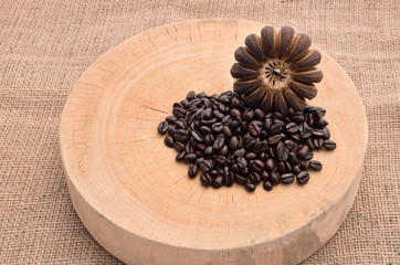 Fresh coffee beans on the wooden  and the hemp sack .Selective focus with shallow depth of field.