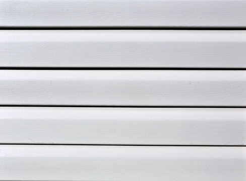 Installation on facade panels beige vinyl siding
