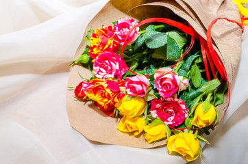 Bouquet of  pink, yellow, orange and red fresh roses