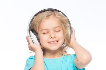 Little girl enjoying the music. 