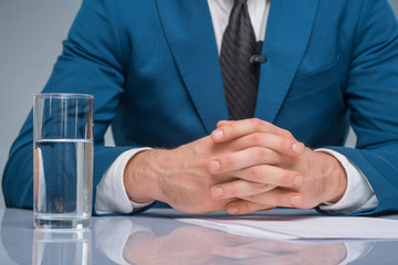 Newsman sitting at his workplace. 
