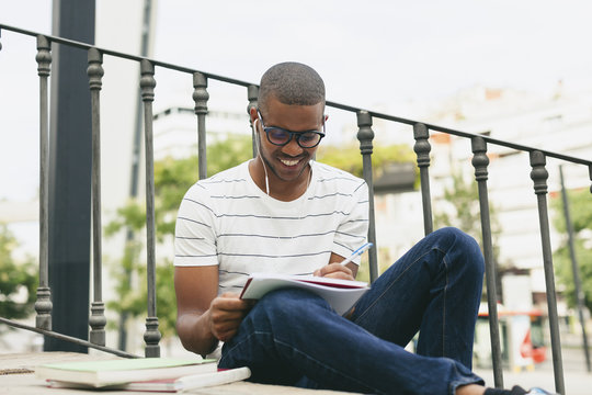 Young Afro-American man studying language