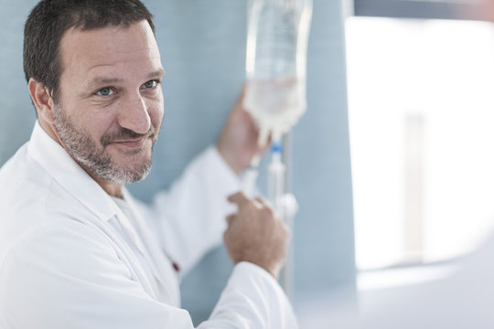 Doctor in hospital at IV drip