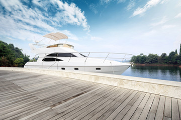 Fototapeta na wymiar skyline wooden floor and yacht on lake