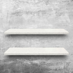 White stone shelves on bare concrete wall background