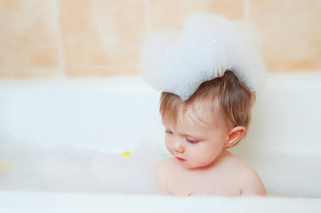 Cute little girl in bathroom