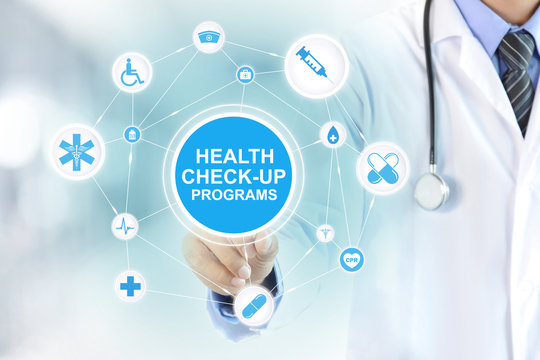 Doctor Hand Touching HEALTH CHECK-UP PROGRAMS Sign On Virtual Screen