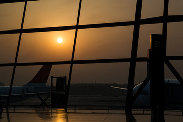 Silhouette of planes in the airport waiting at  gates
