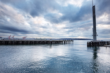 Obraz premium wooden dock on the sea in cloudy sky