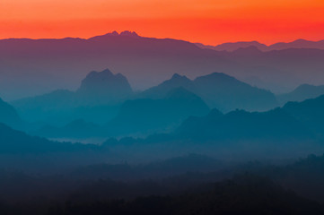 Fototapeta na wymiar Colorful multi colors of silhouette mountain and sky at twilight