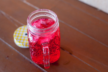 red soda water on the wood floor 