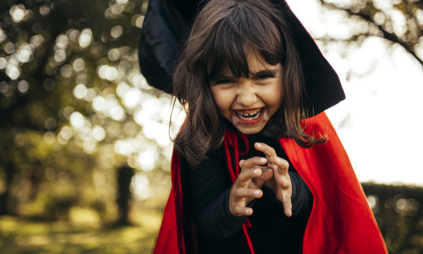 Portrait of little girl masquerade as vampire