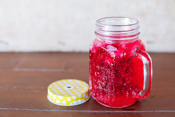 red soda water on the wood floor 