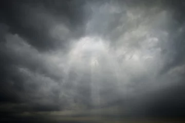 Papier Peint photo Lavable Ciel Dark Clouds rain storm and sun beam in storm. Dramatic sky background