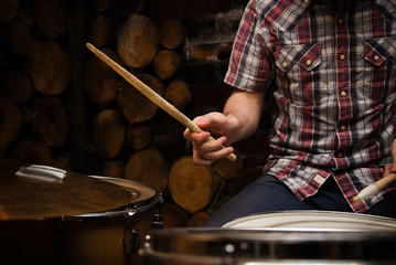 Drummer with sticks and drums