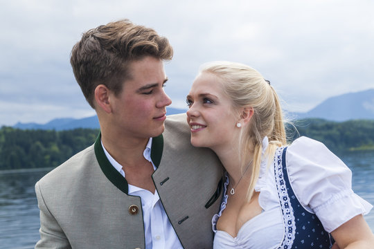 Germany, Bavaria, portrait of young couple wearing traditional clothes