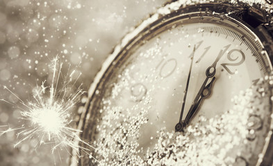 Old watch pointing midnight - New Year concept