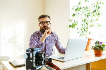 Beard young man working from home