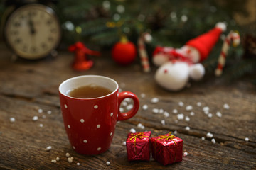 Close up of tea cup with christmas decoration on wooden table