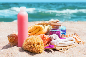 Spa beauty products: towels, soap, shells, sea salt on the sea c