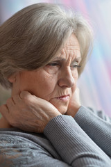 Portrait of thinking elderly woman