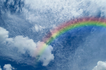 Blue sky with rainbow