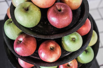 Red and green apples on a plate