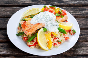 Pan fried Salmon with tender asparagus, courgette served on couscous mixed with sweet tomato, yellow pepper, with greek yogurt