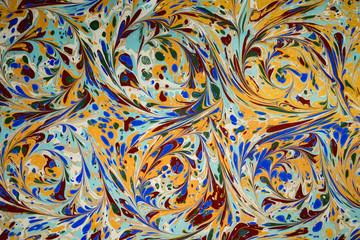 Ebru art. Traditional Turkish Ebru technique. Painting on water, followed by paper prints. Color...